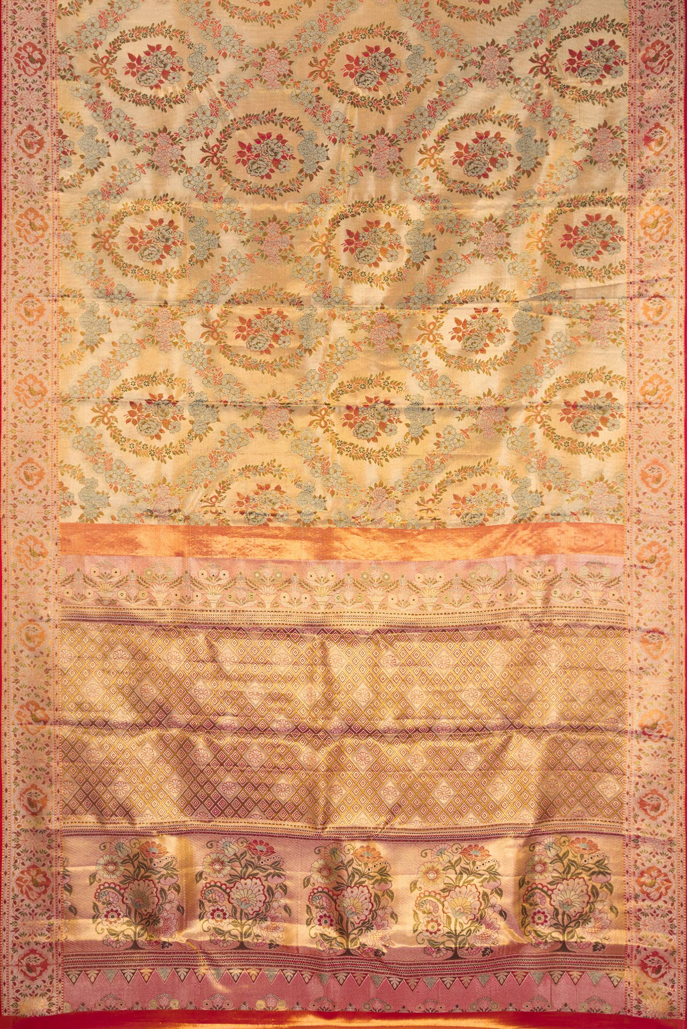 Flat view of Gold Dual Tone Kanjivaram Tissue Silk Saree with Zari Brocade on the body and Fancy Border. 