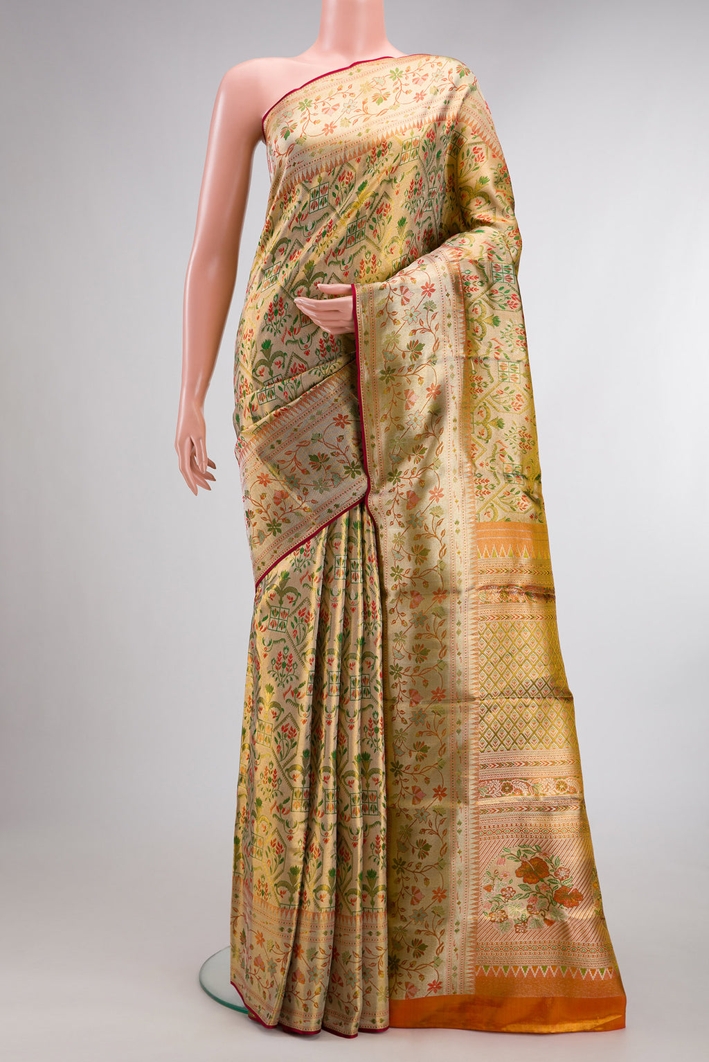 Gold Dual Tone Kanjivaram Tissue Saree with Zari Brocade on the body and Fancy Border.  displayed on a mannequin