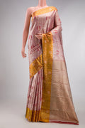 Rose Gold Dual Tone Kanjivaram Tissue Silk Saree with Zari Brocade on the body and Fancy Border.  displayed on a mannequin