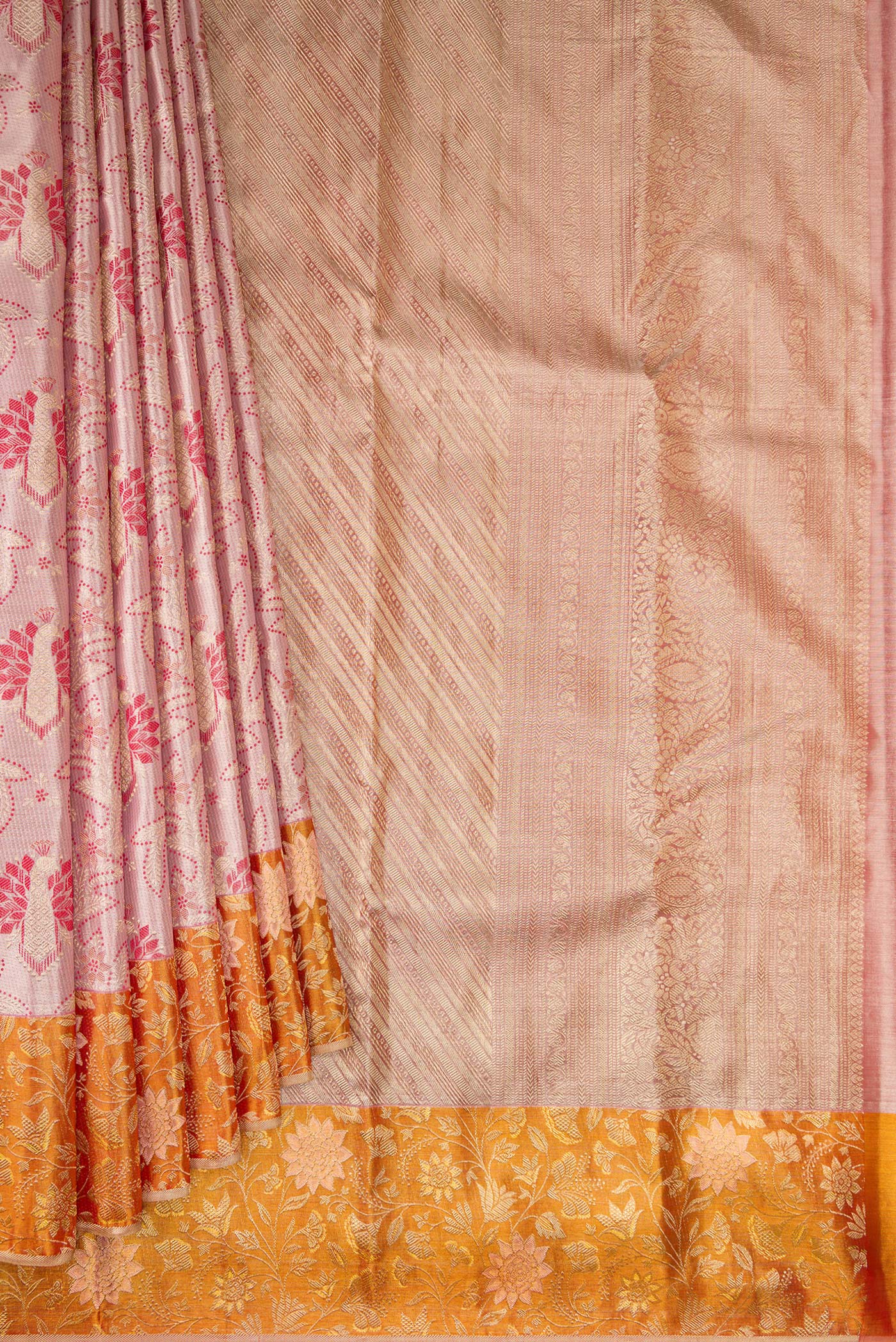 Pleats and pallu of Rose Gold Dual Tone Kanjivaram Tissue Silk Saree with Zari Brocade on the body and Fancy Border. 