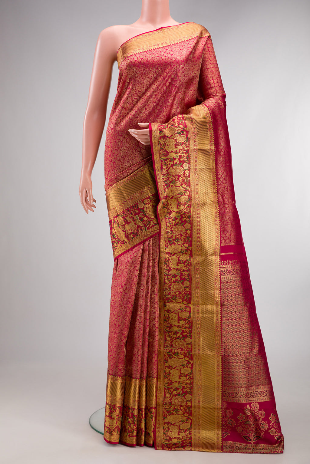 Dark Pink Dual Tone Kanjivaram Silk Saree with Zari Brocade on the body and Fancy Border.  displayed on a mannequin