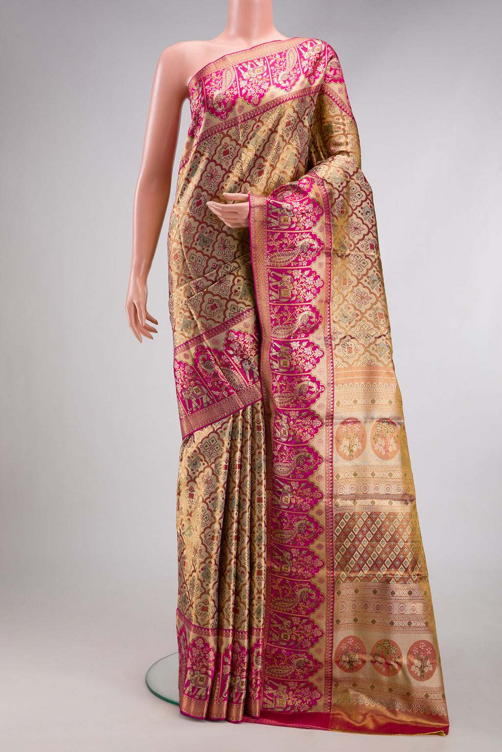 Gold Dual Tone Kanjivaram Tissue Silk Saree with Zari Brocade on the body and Fancy Border.  displayed on a mannequin