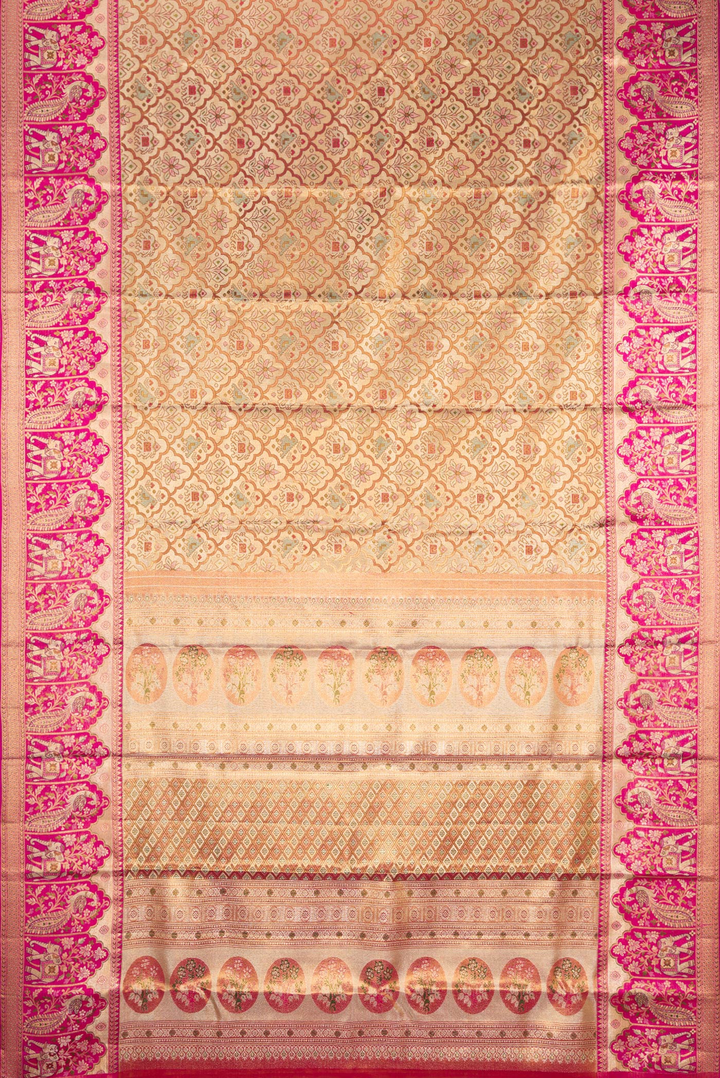 Flat view of Gold Dual Tone Kanjivaram Tissue Silk Saree with Zari Brocade on the body and Fancy Border. 
