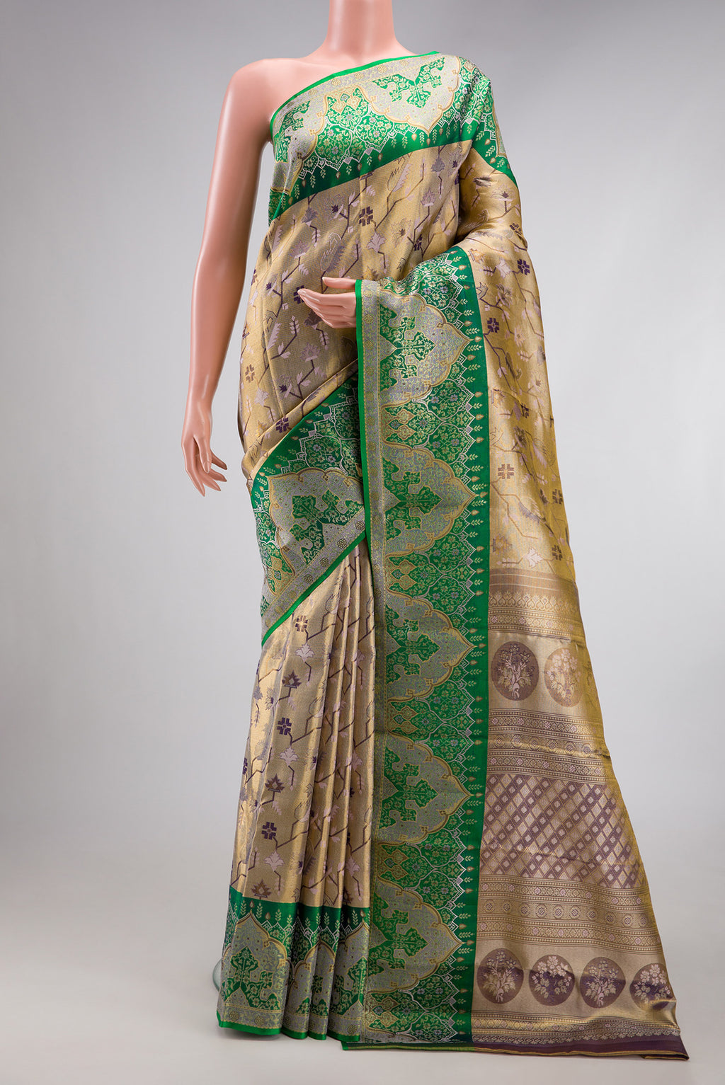 Gold Dual Tone Kanjivaram Tissue Silk Saree with Zari Brocade on the body and Fancy Border.  displayed on a mannequin