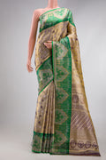 Gold Dual Tone Kanjivaram Tissue Silk Saree with Zari Brocade on the body and Fancy Border.  displayed on a mannequin