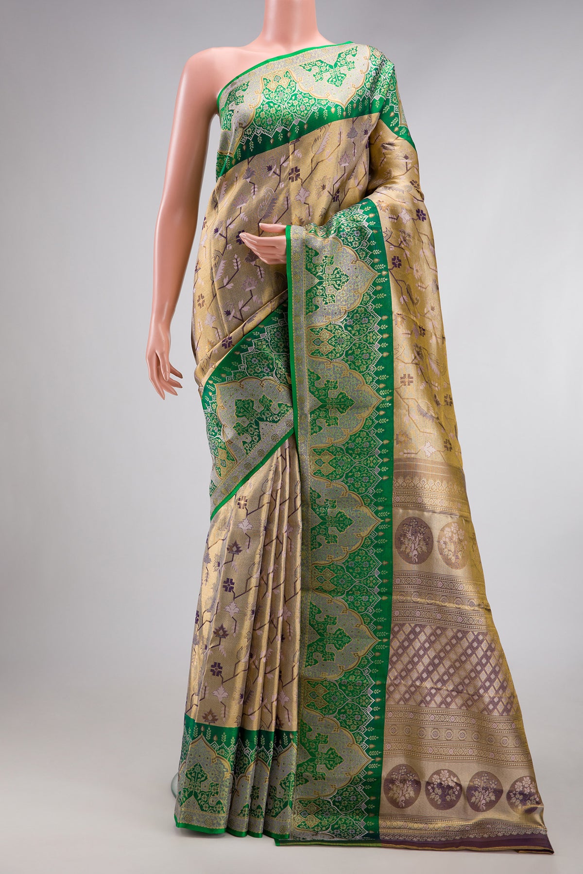 Gold Dual Tone Kanjivaram Tissue Silk Saree with Zari Brocade on the body and Fancy Border.  displayed on a mannequin