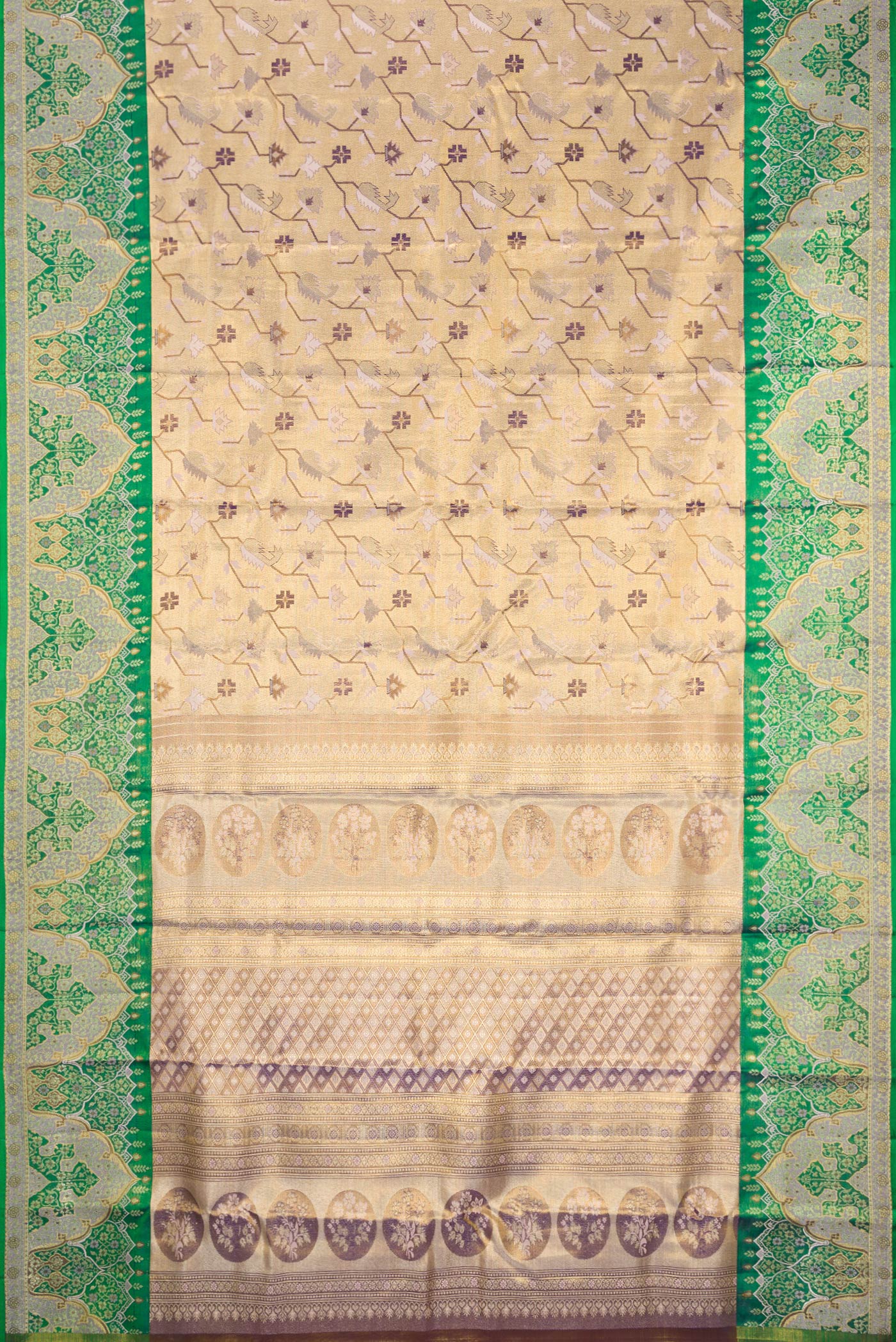 Flat view of Gold Dual Tone Kanjivaram Tissue Silk Saree with Zari Brocade on the body and Fancy Border. 