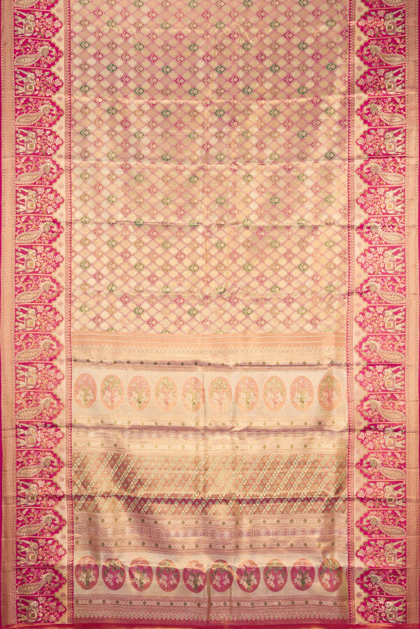 Flat view of Gold Dual Tone Kanjivaram Tissue Silk Saree with Zari Brocade on the body and Fancy Border. 