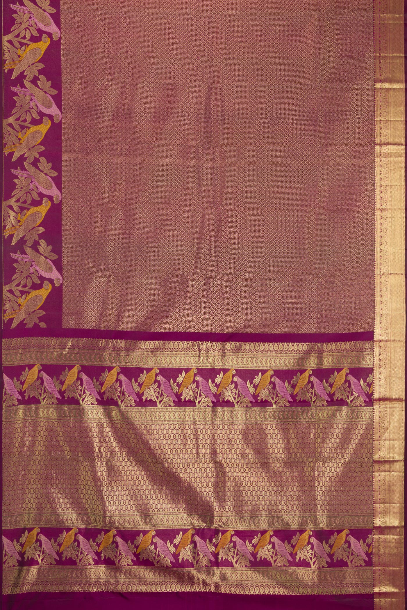 Flat view of Purple Kanjivaram Silk Saree with Zari Brocade on the body and Fancy Border. 