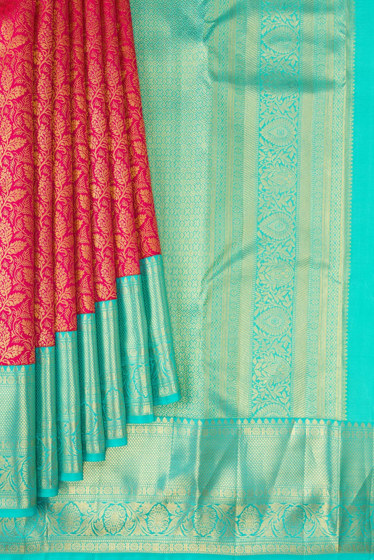 Pleats and pallu of Dark Pink Kanjivaram Silk Saree with Zari Brocade on the body and Zari Border. 