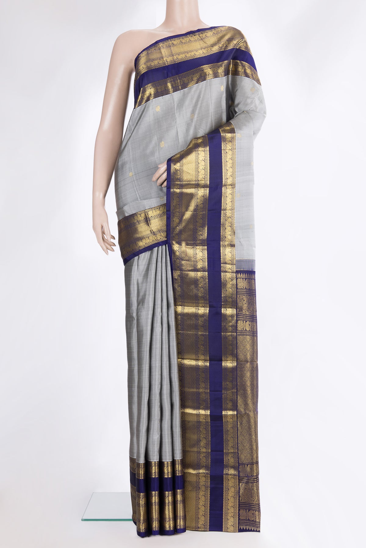 Pure Silk Grey Dual Tone Kanchipuram Saree with Zari Butta on the body and Zari Border.  displayed on a mannequin