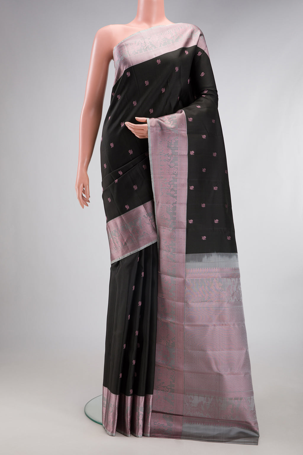 Black Kanchipuram Silk Saree with Thread Butta on the body and Thread Border.  displayed on a mannequin