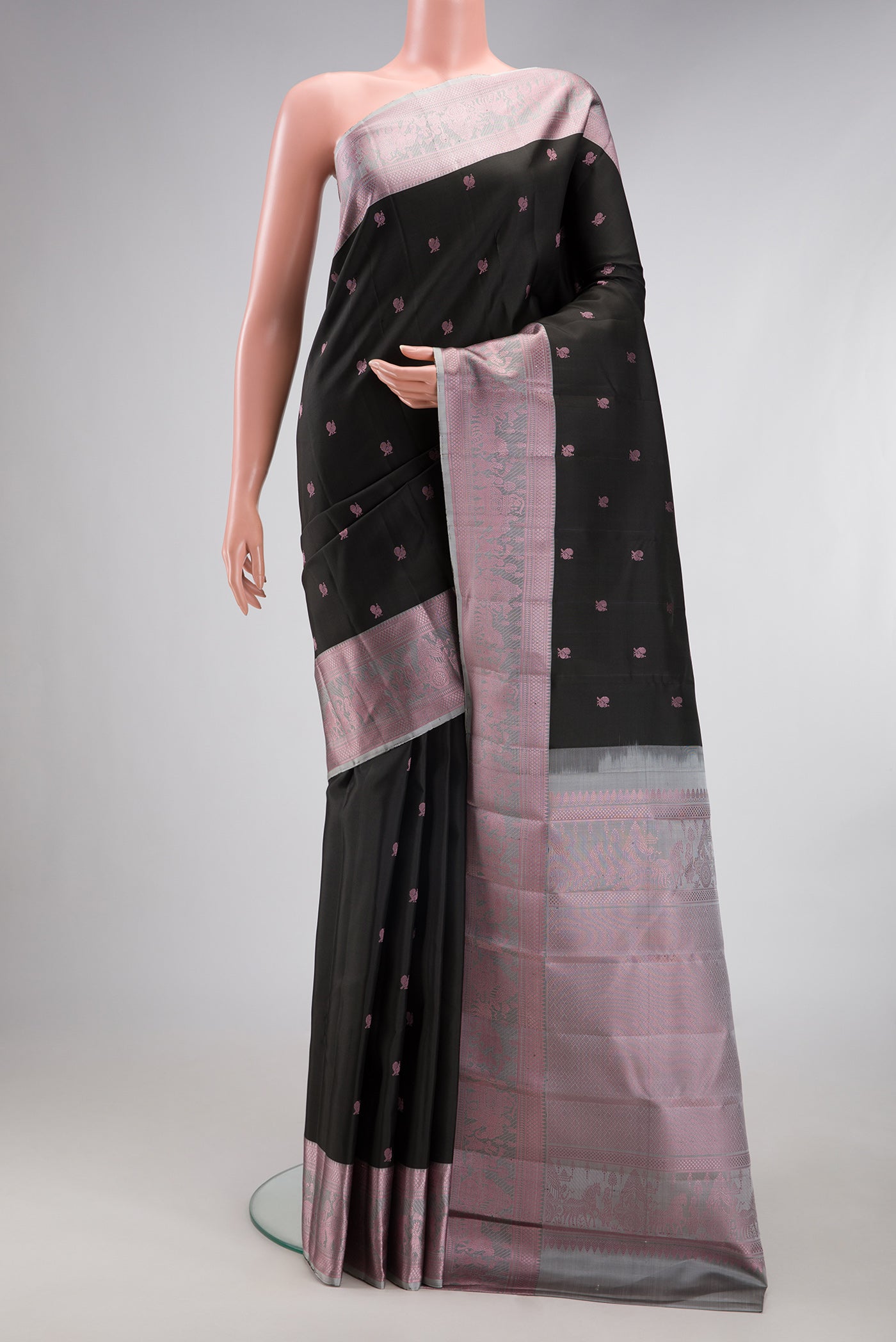 Black Kanchipuram Silk Saree with Thread Butta on the body and Thread Border.  displayed on a mannequin