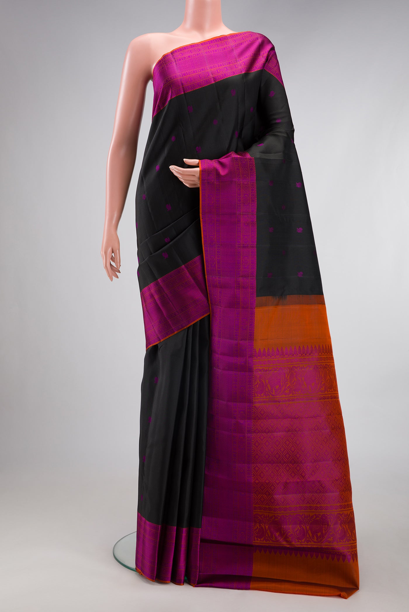 Black Kanchipuram Silk Saree with Thread Butta on the body and Thread Border.  displayed on a mannequin