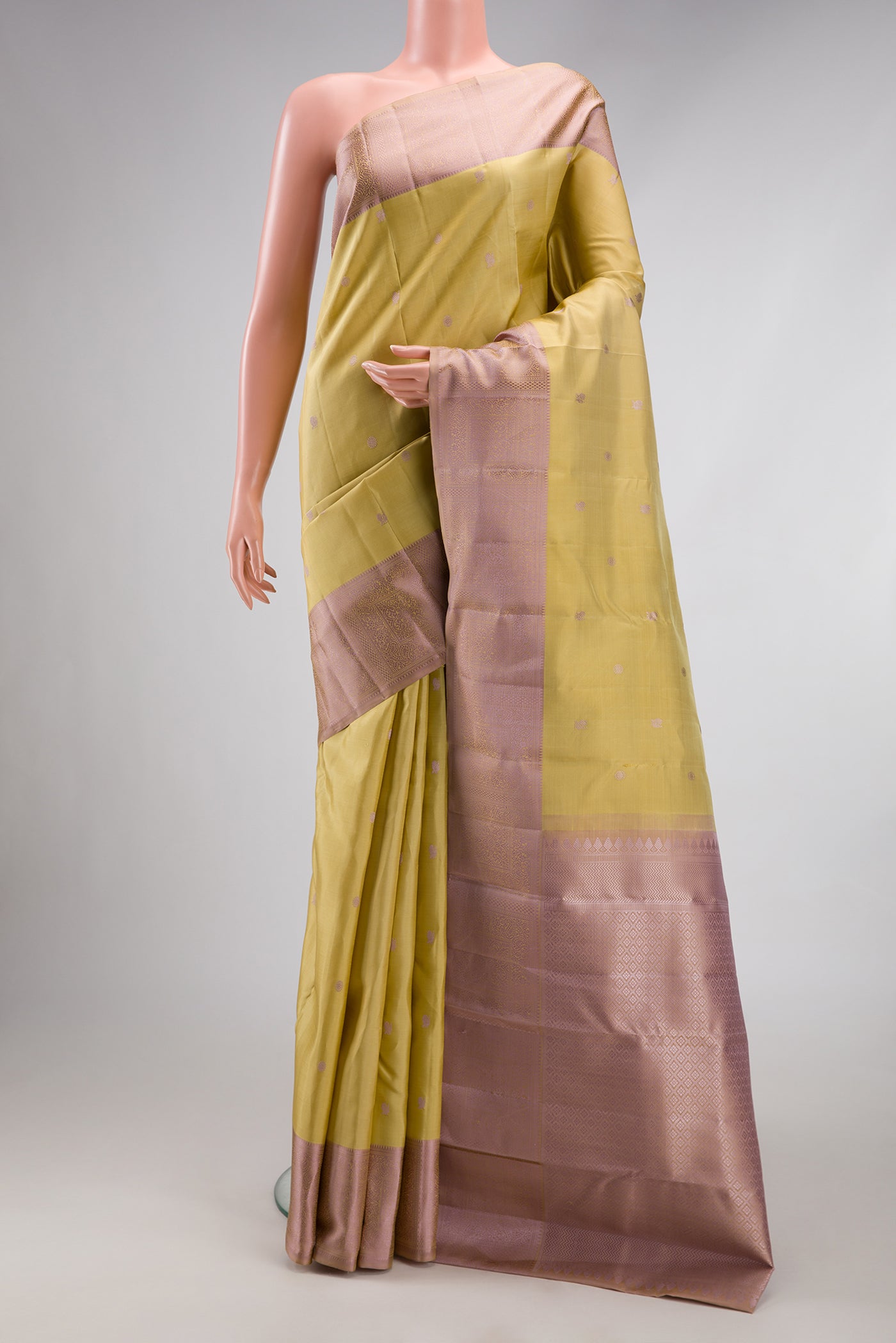 Sandal Kanchipuram Silk Saree with Thread Butta on the body and Thread Border.  displayed on a mannequin