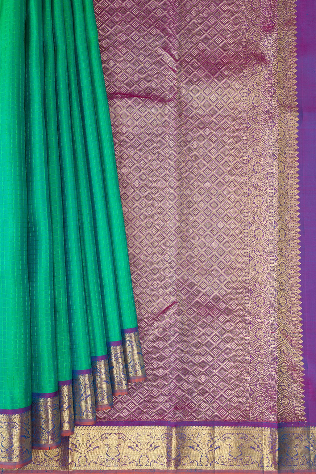 Pleats and pallu of Green Kanchipuram Silk Saree with Checked design on the body and Zari Border. 