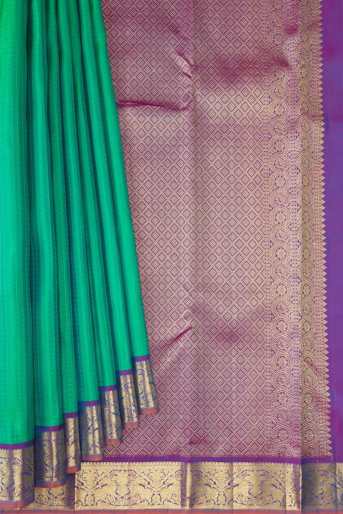 Pleats and pallu of Green Kanchipuram Silk Saree with Checked design on the body and Zari Border. 