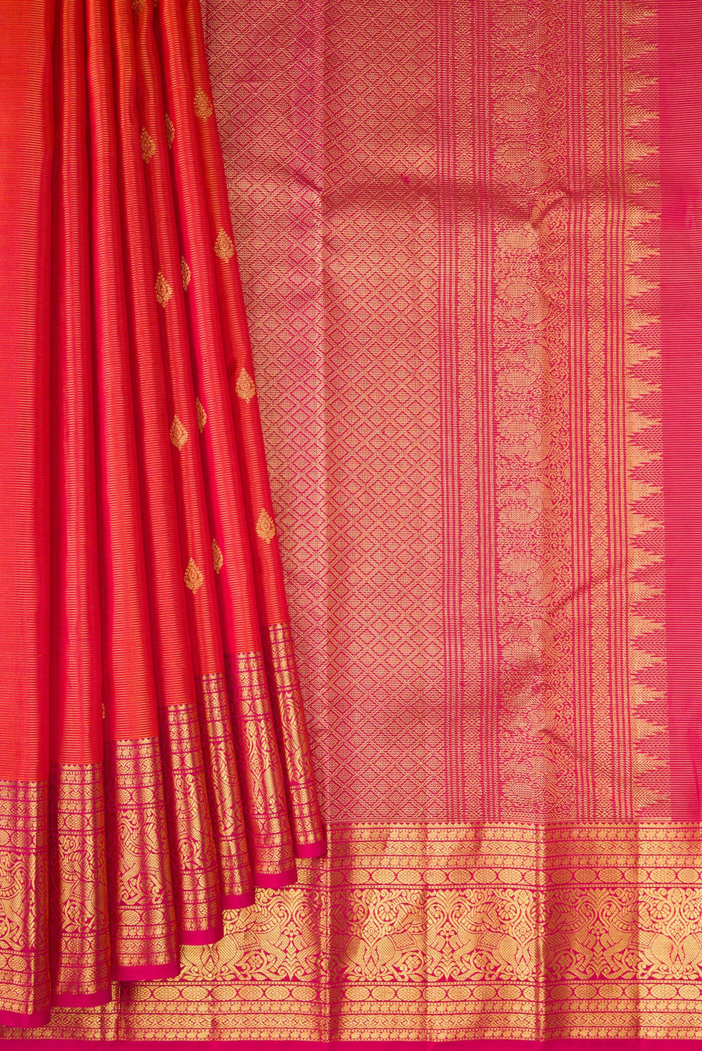 Pleats and pallu of Orange Kanchipuram Silk Saree with Stripes on the body and Fancy Border. 