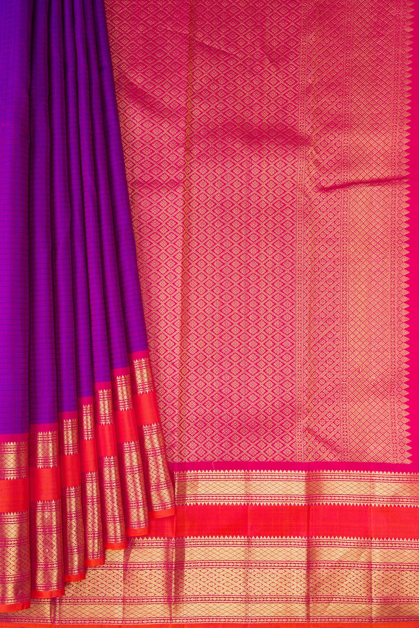 Pleats and pallu of Purple Kanchipuram Silk Saree with Checked design on the body and Zari Border. 