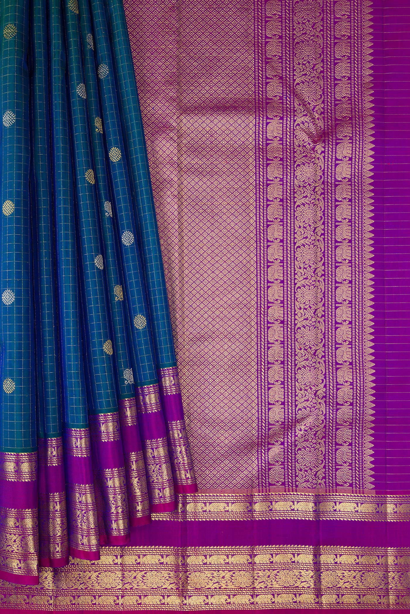 Pleats and pallu of Peacock Blue Dual Tone Kanjivaram Silk Saree with Checked design on the body and Fancy Border. 