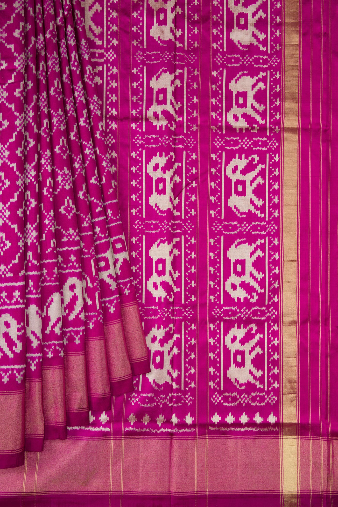 Pleats and pallu of Magenta Double Ikat Saree with Pure Ikat on the body and Zari Border. 
