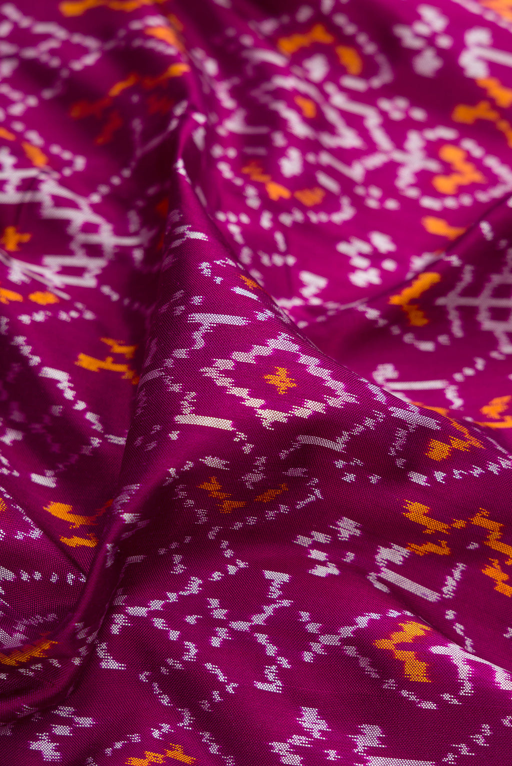 Close up of Purple Double Ikat Saree with Pure Ikat on the body and Ikat Border.  displaying folds