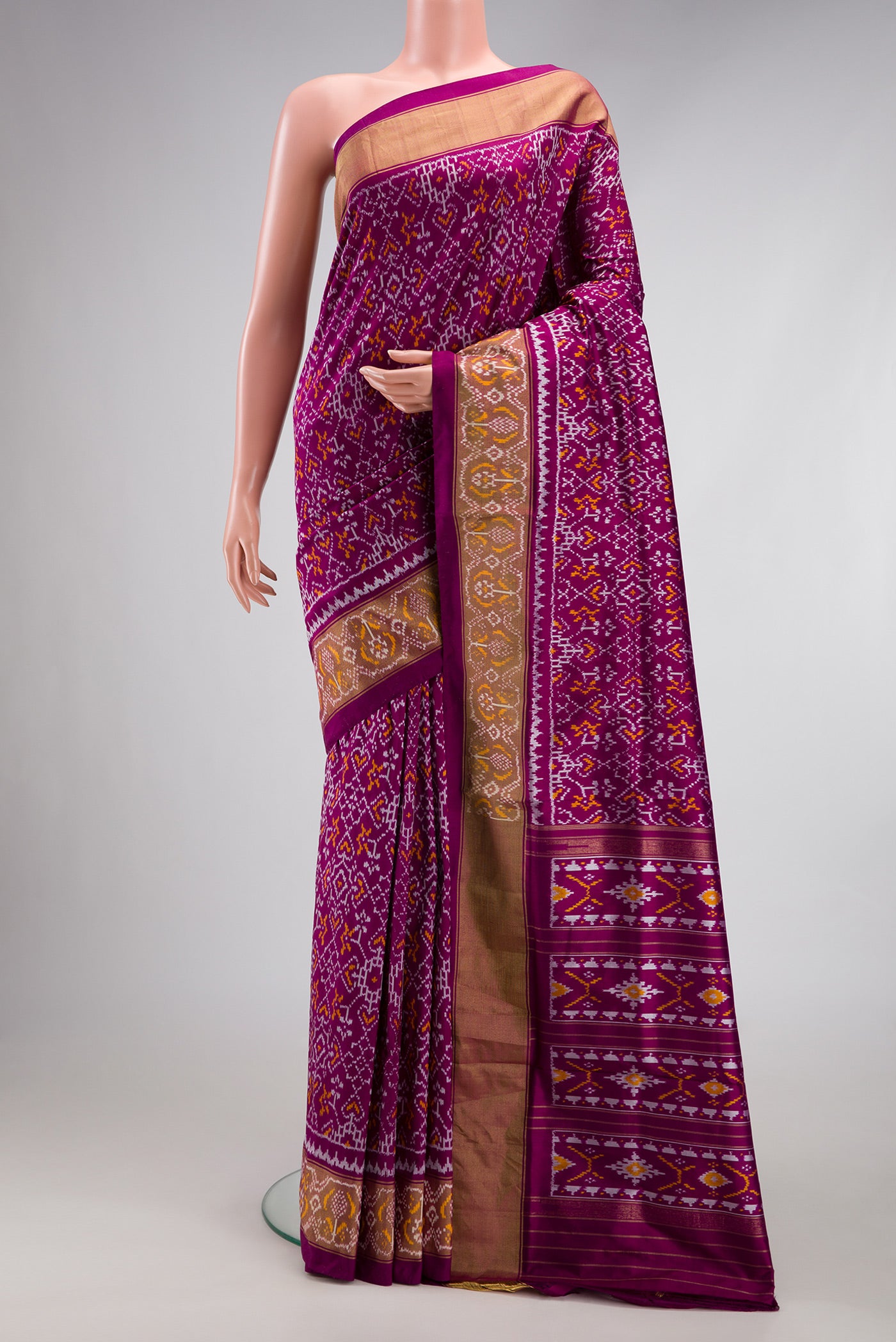 Purple Double Ikat Saree with Pure Ikat on the body and Ikat Border.  displayed on a mannequin