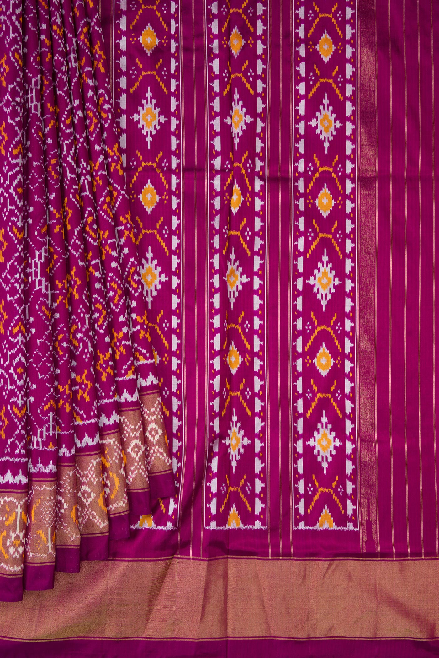 Pleats and pallu of Purple Double Ikat Saree with Pure Ikat on the body and Ikat Border. 