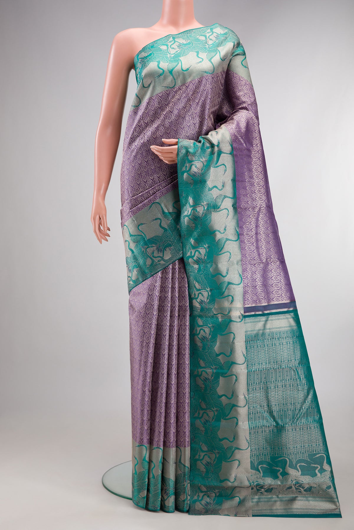 Lavender Dual Tone Kanchipuram Tissue Silk Saree with Zari Brocade on the body and Fancy Border.  displayed on a mannequin