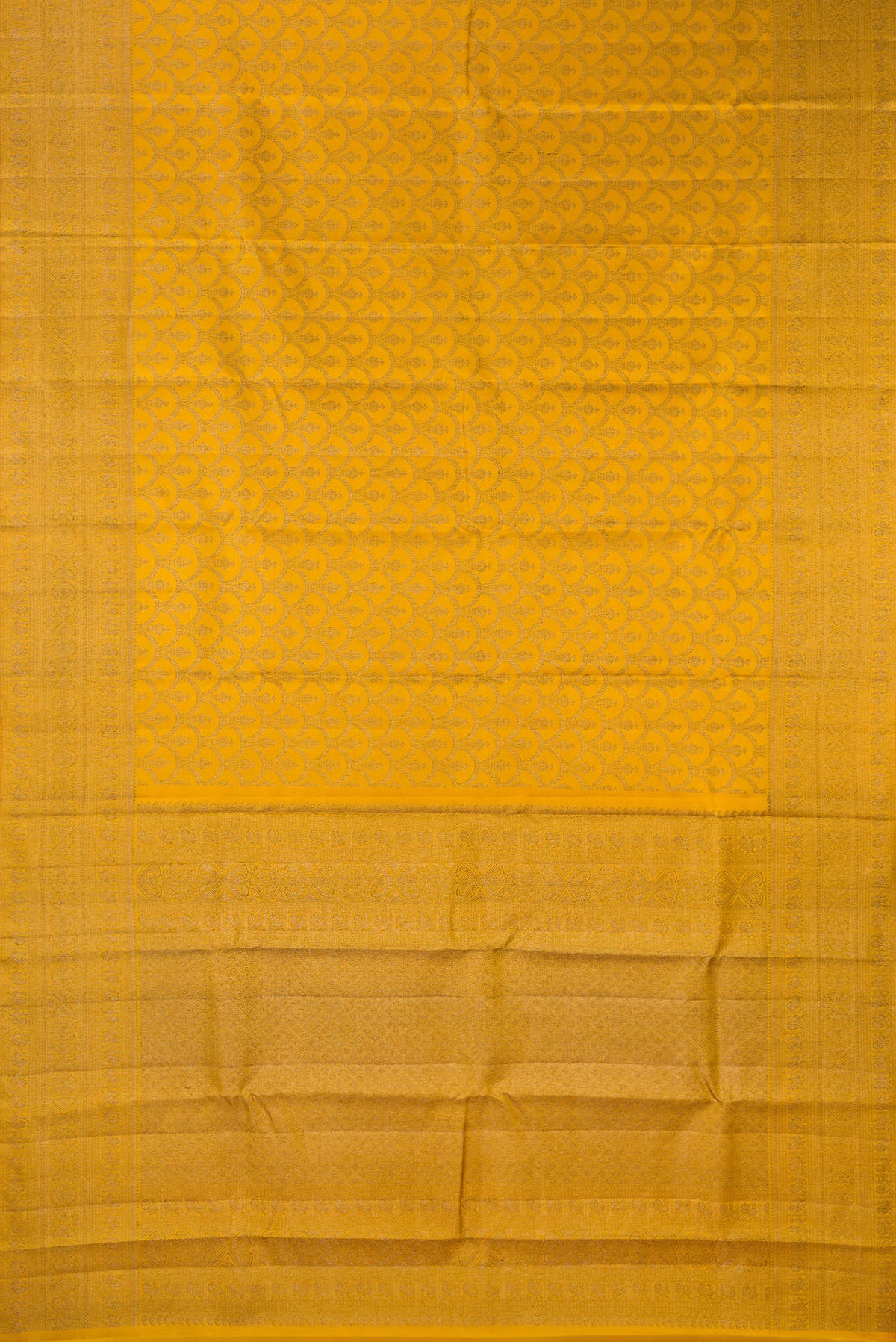 Flat view of Pure Silk Mustard Kanjivaram Saree with Zari Brocade on the body and Zari Border. 