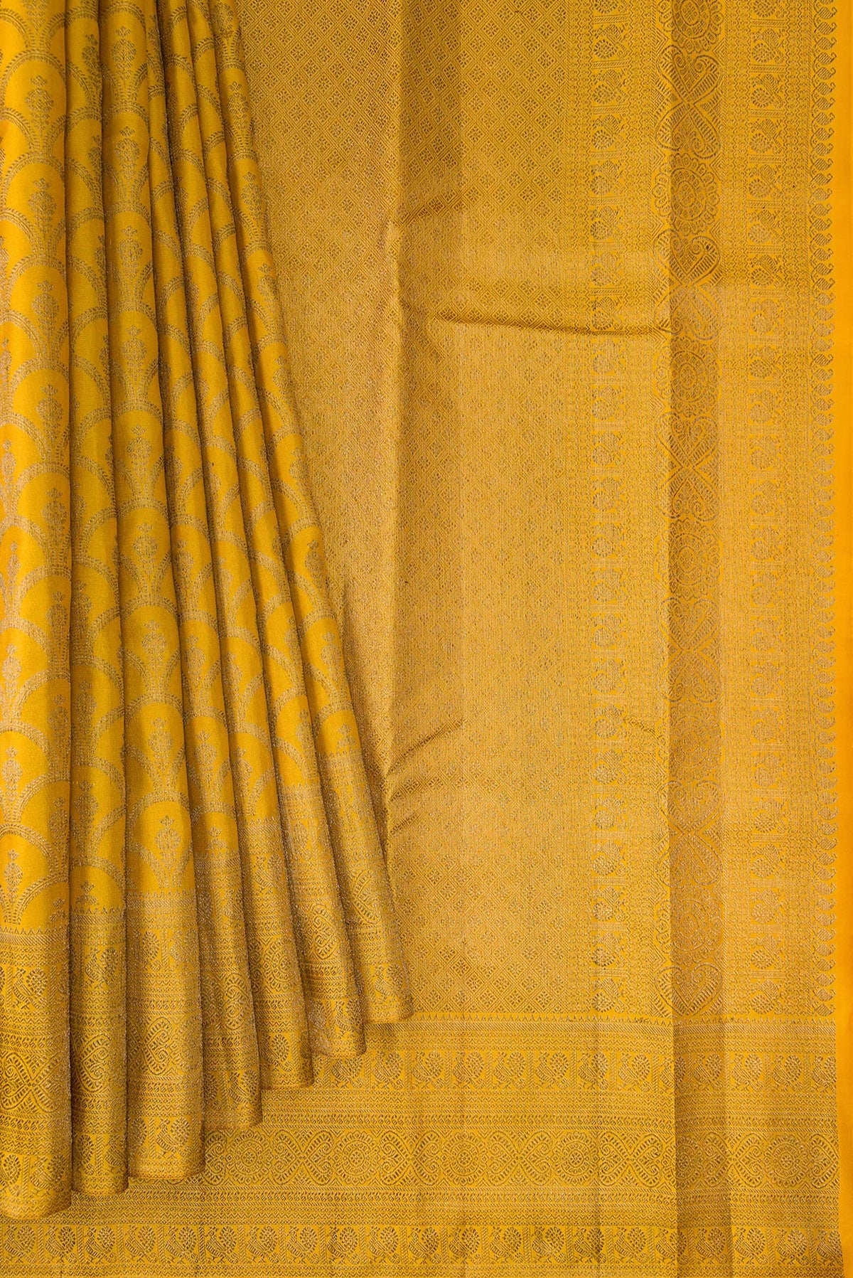 Pleats and pallu of Pure Silk Mustard Kanjivaram Saree with Zari Brocade on the body and Zari Border. 