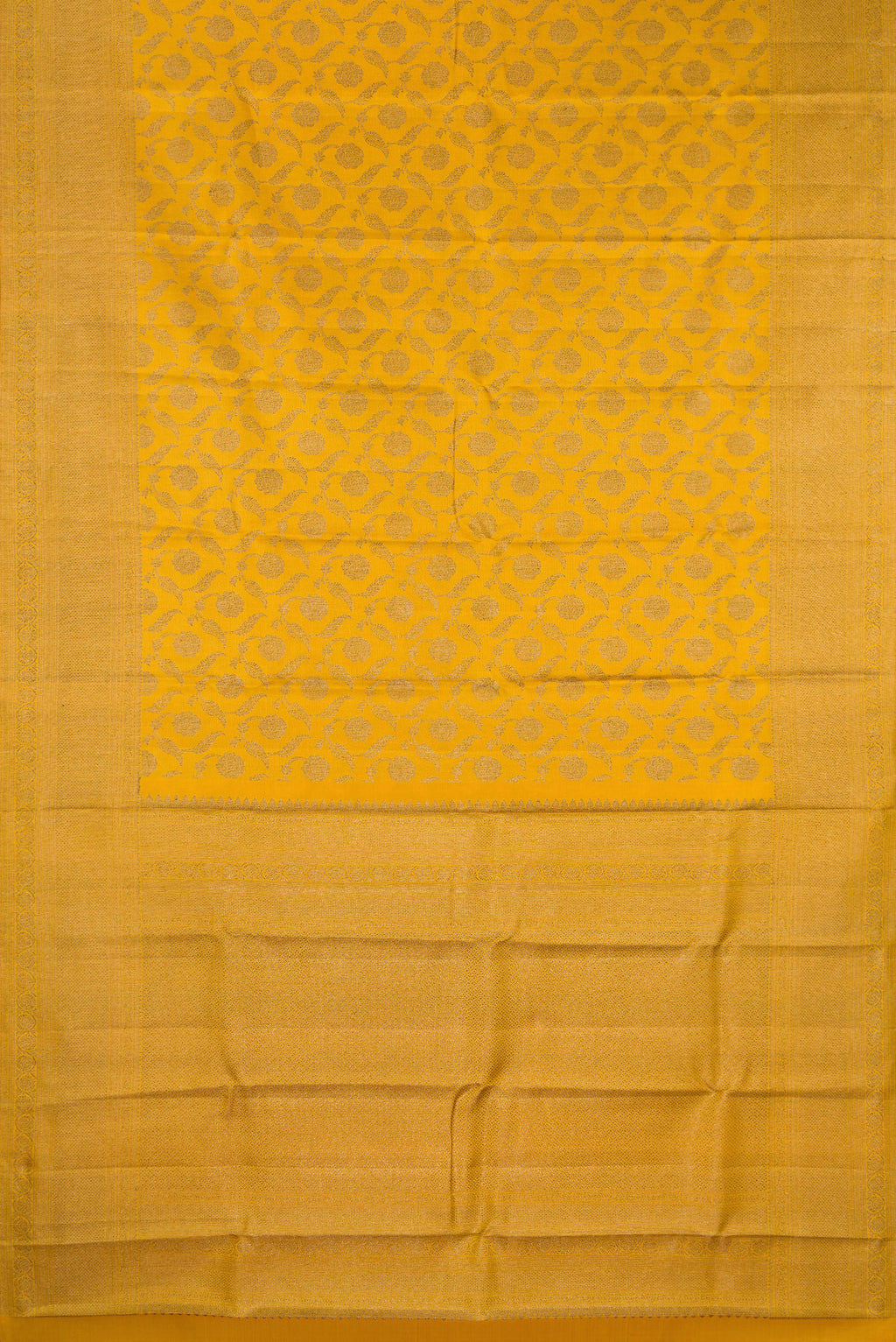 Flat view of Pure Silk Mustard Kanjivaram Saree with Zari Brocade on the body and Fancy Border. 