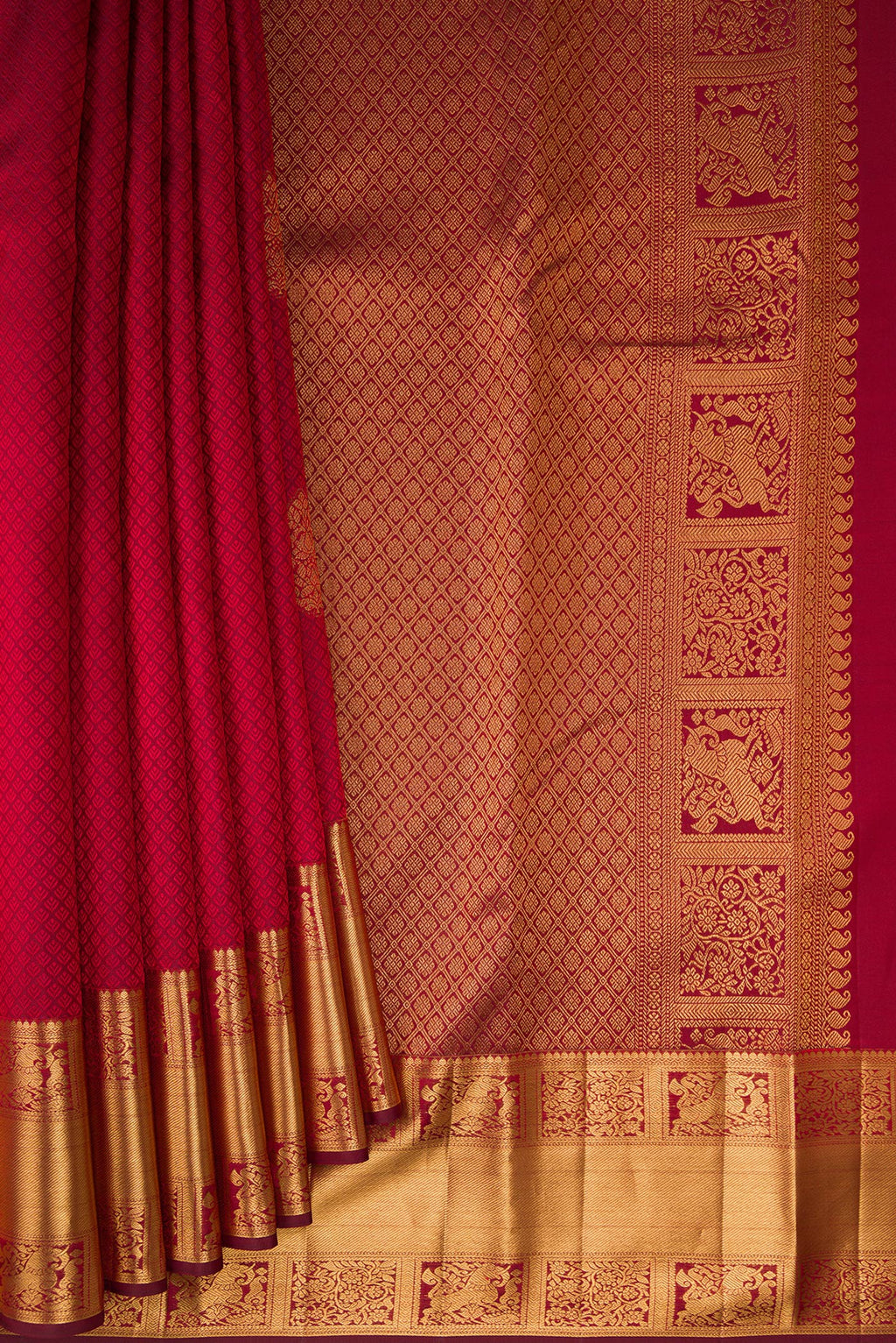 Pleats and pallu of Maroon Kanjivaram Silk Saree with Jacquard With Zari Butta on the body and Zari Border. 