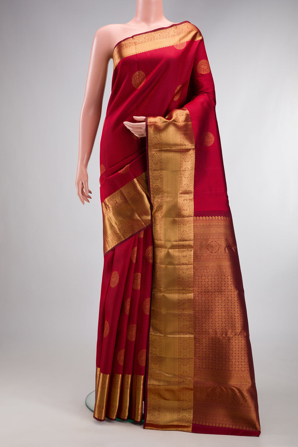 Maroon Kanjivaram Silk Saree with Jacquard With Zari Butta on the body and Zari Border.  displayed on a mannequin