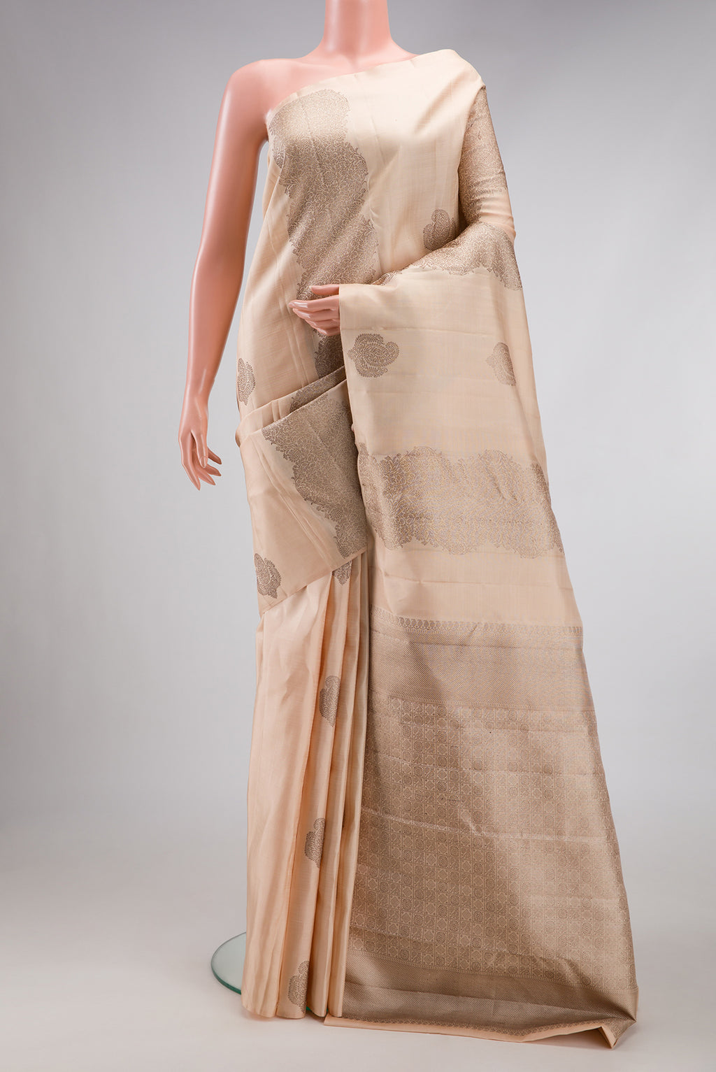 Sandal Kanjivaram Silk Saree with Zari Butta on the body and Without Border.  displayed on a mannequin