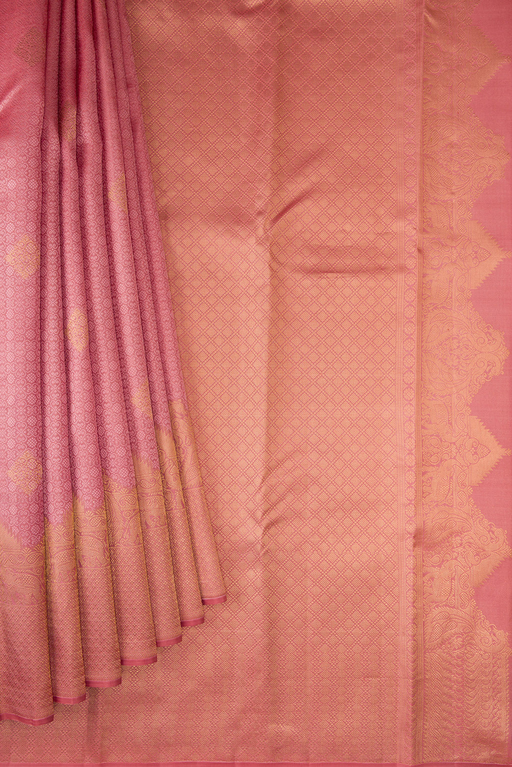 Pleats and pallu of Rose pink Kanjivaram Silk Saree with Jacquard design on the body and Fancy Border. 