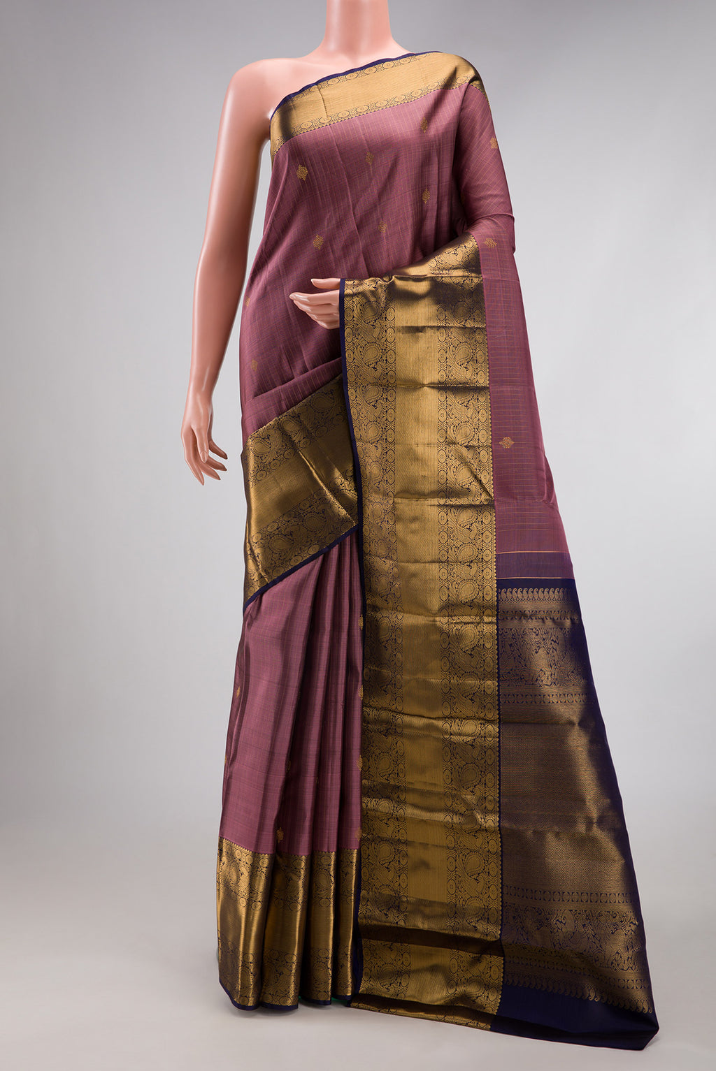 Pink Dual Tone Kanjivaram Silk Saree with Stripes on the body and Zari Border.  displayed on a mannequin