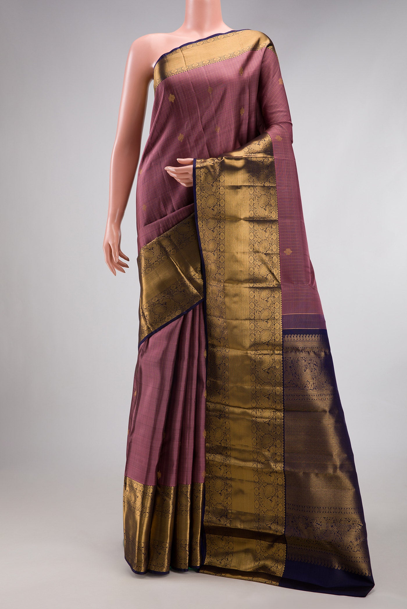 Pink Dual Tone Kanjivaram Silk Saree with Stripes on the body and Zari Border.  displayed on a mannequin