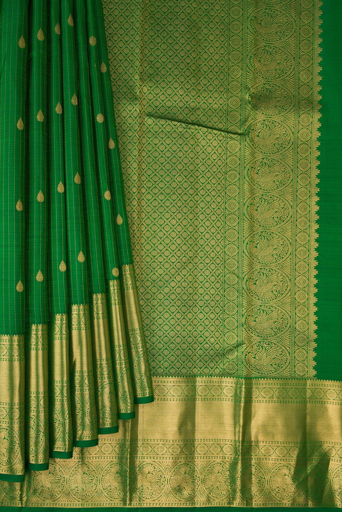Pleats and pallu of Pure Silk Green Kanjivaram Saree with Checked design on the body and Zari Border. 