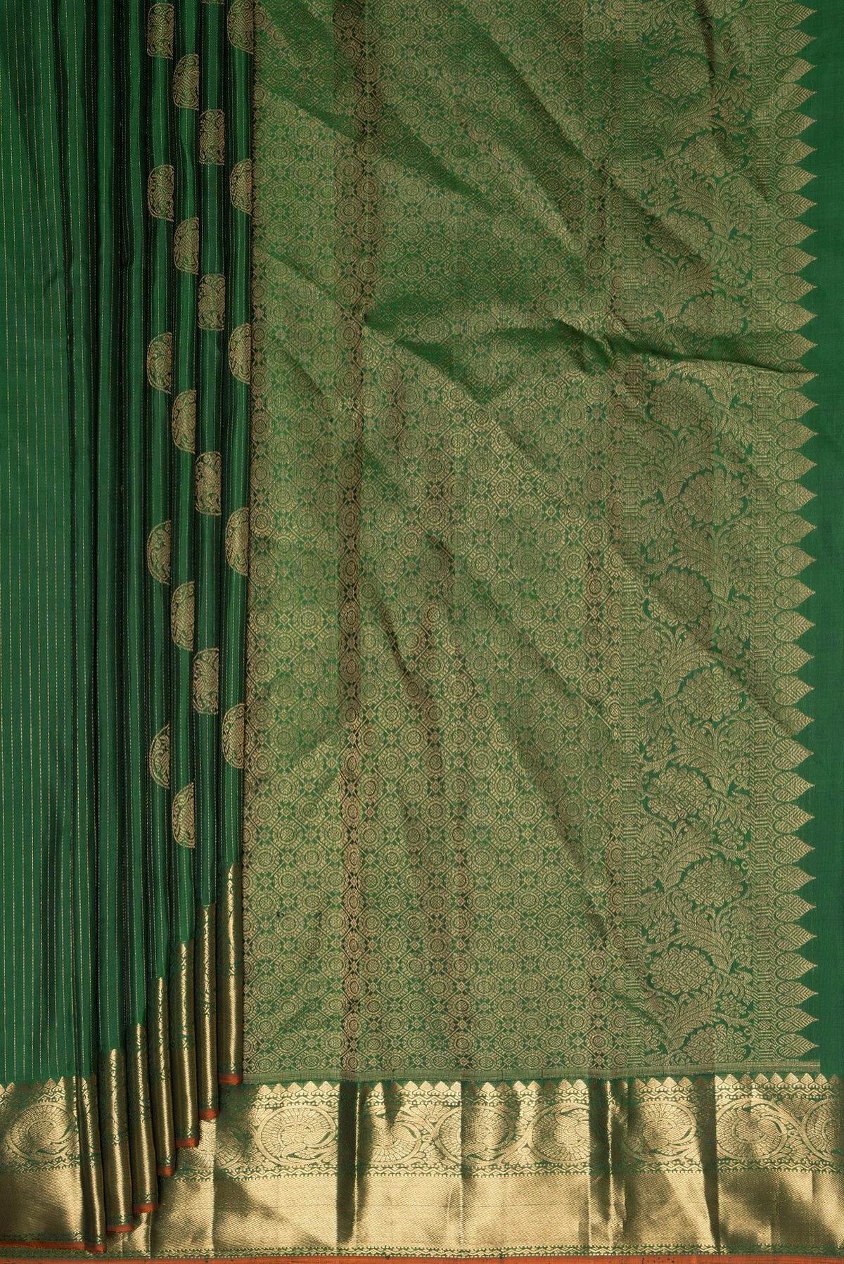 Pleats and pallu of Pure Silk Green Kanjivaram Saree with Stripes on the body and Zari Border. 