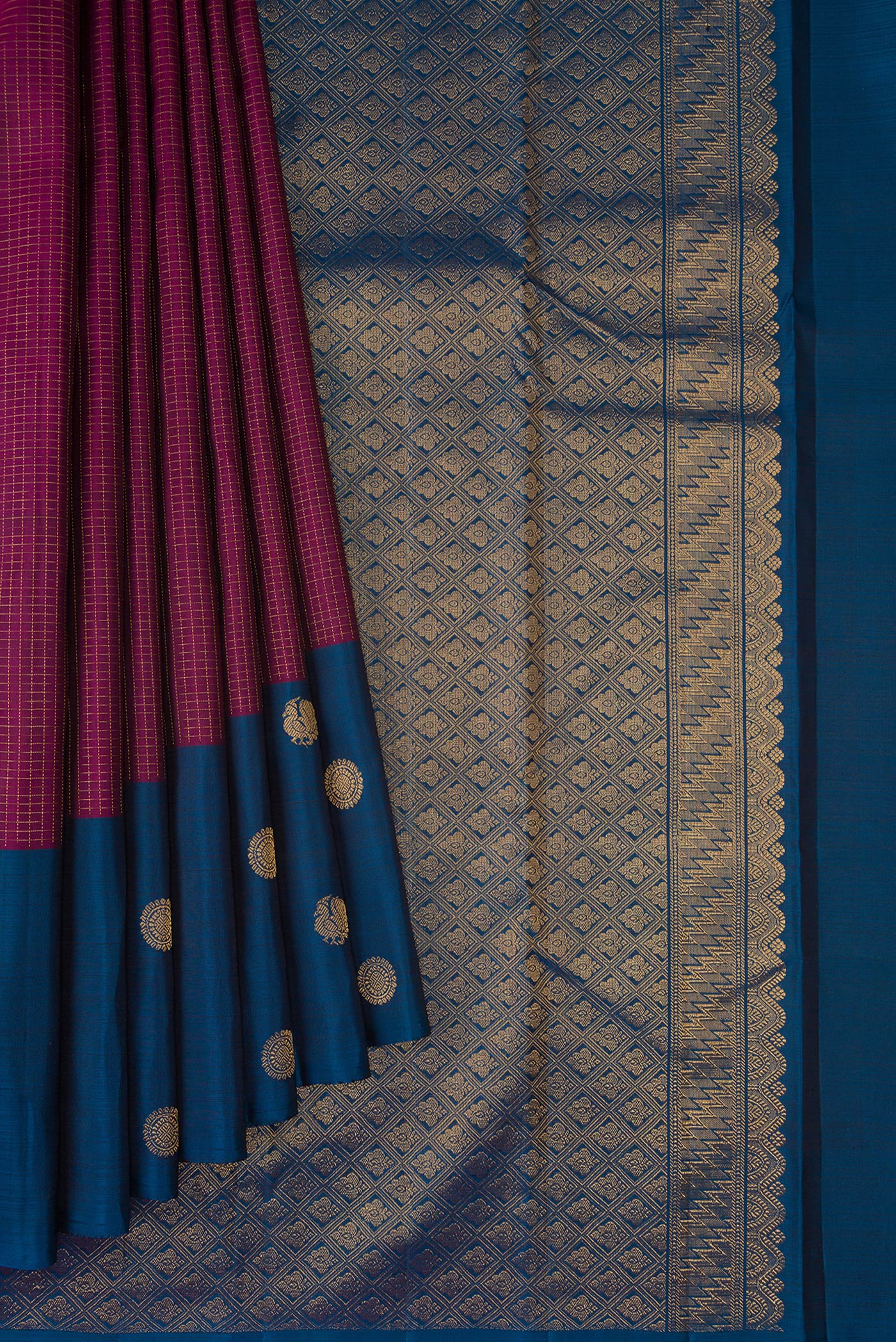 Pleats and pallu of Magenta Kanjivaram Silk Saree with Checked design on the body and Fancy Border. 