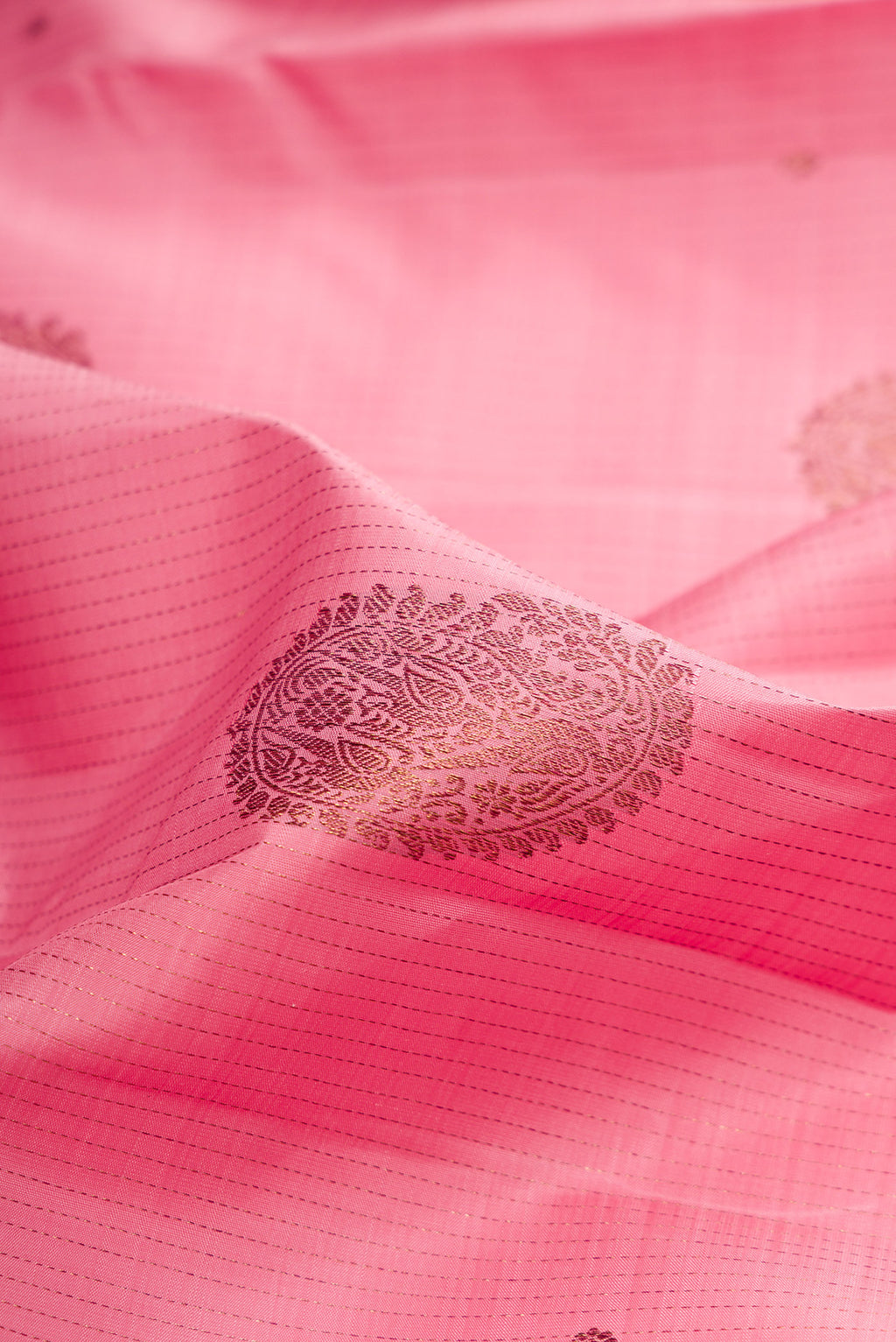 Close up of Pink Kanjivaram Silk Saree with Stripes on the body and Without Border.  displaying folds