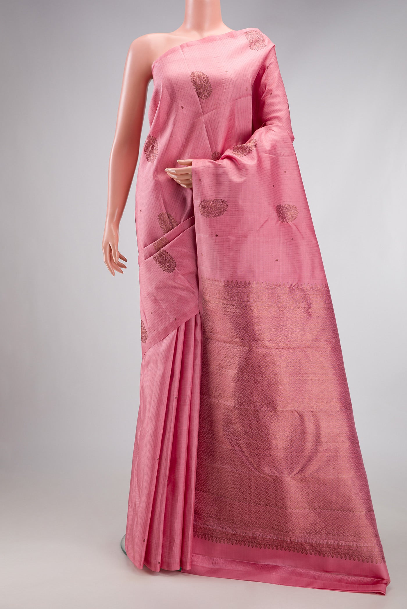 Pink Kanjivaram Silk Saree with Stripes on the body and Without Border.  displayed on a mannequin