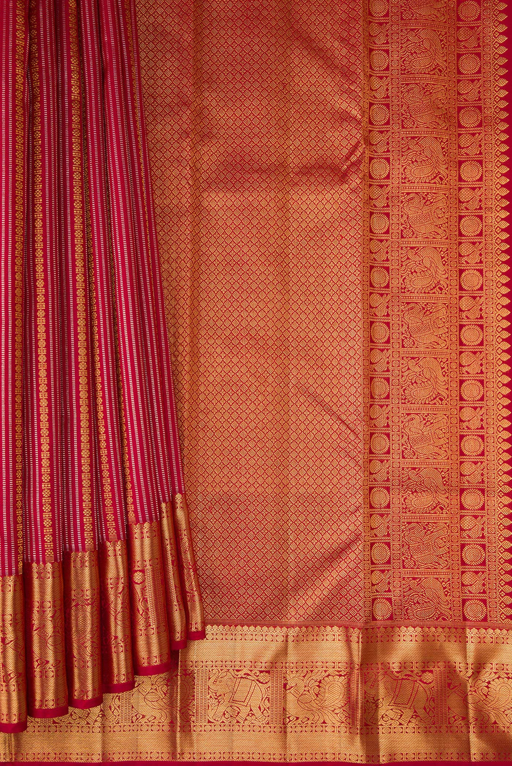 Pleats and pallu of Maroon Kanjivaram Silk Saree with Stripes on the body and Zari Border. 