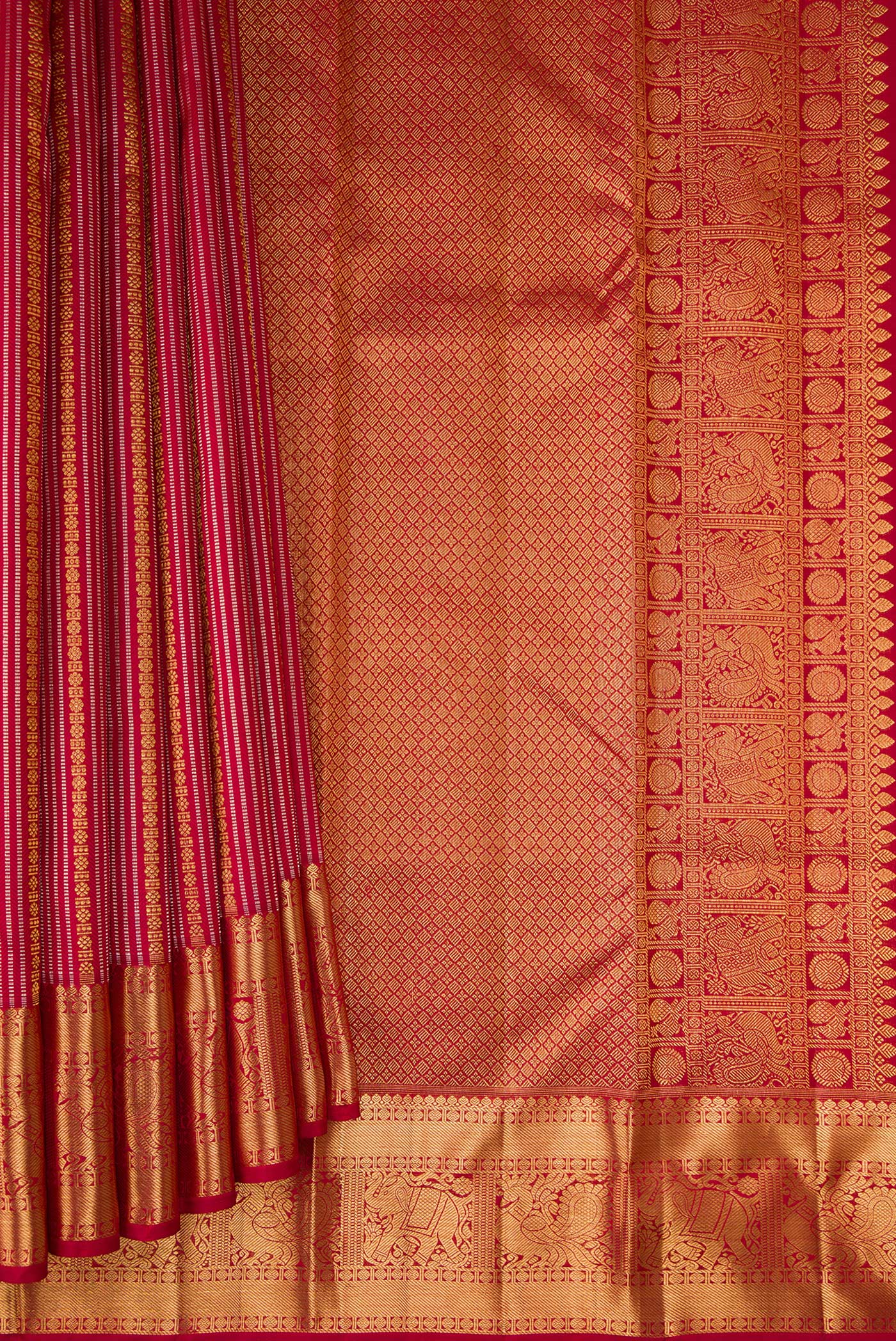 Pleats and pallu of Maroon Kanjivaram Silk Saree with Stripes on the body and Zari Border. 