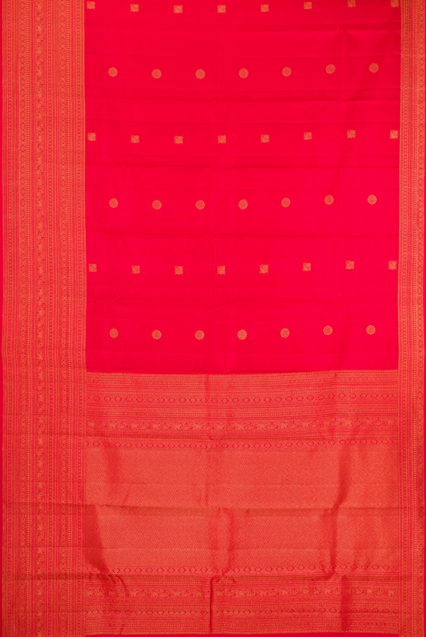 Flat view of Red Kanchipuram Silk Saree with Zari Butta on the body and Fancy Border. 