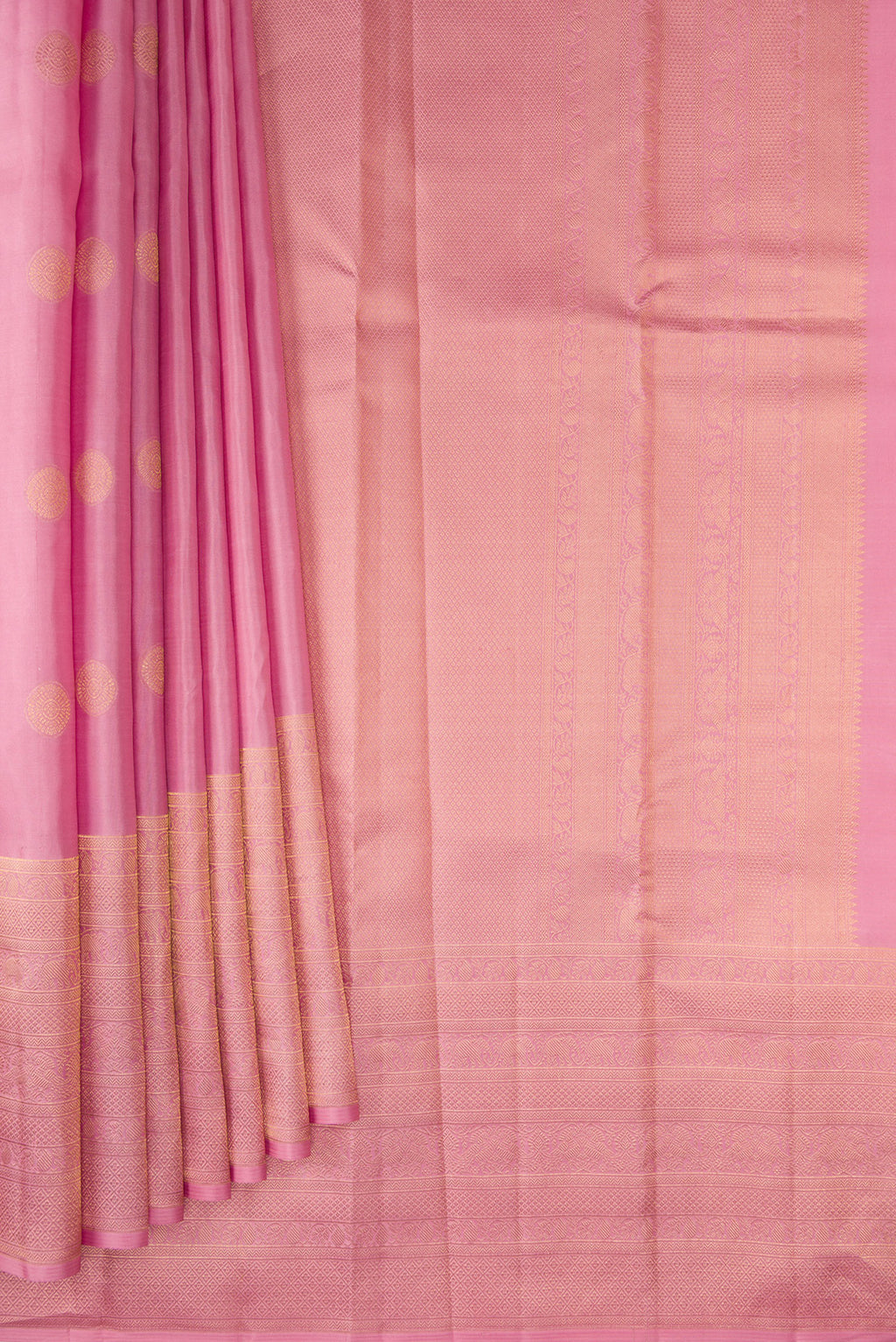 Pleats and pallu of Pure Silk Rose pink Kanchipuram Saree with Zari Butta on the body and Fancy Border. 