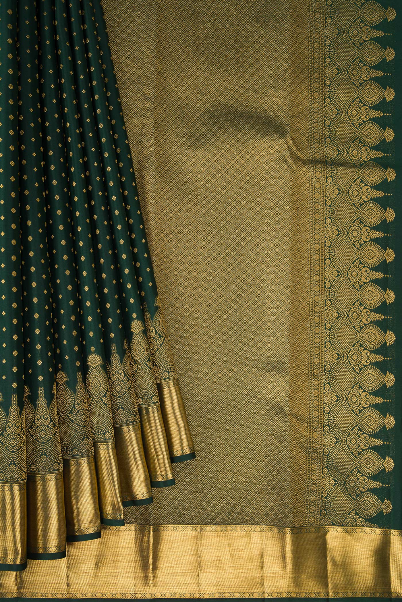 Pleats and pallu of Bottle Green Kanjivaram Silk Saree with Zari Butta on the body and Fancy Border. 