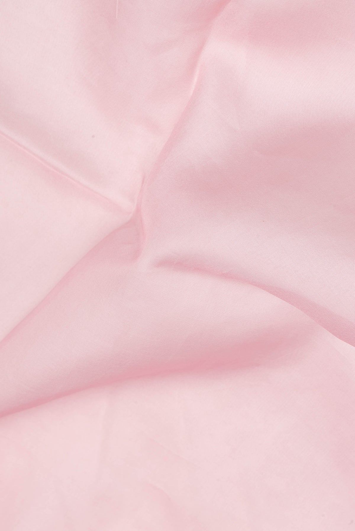 Close up of Pink Dual Tone Organza Saree with Embroidery on the body and Embroidery Border.  displaying folds