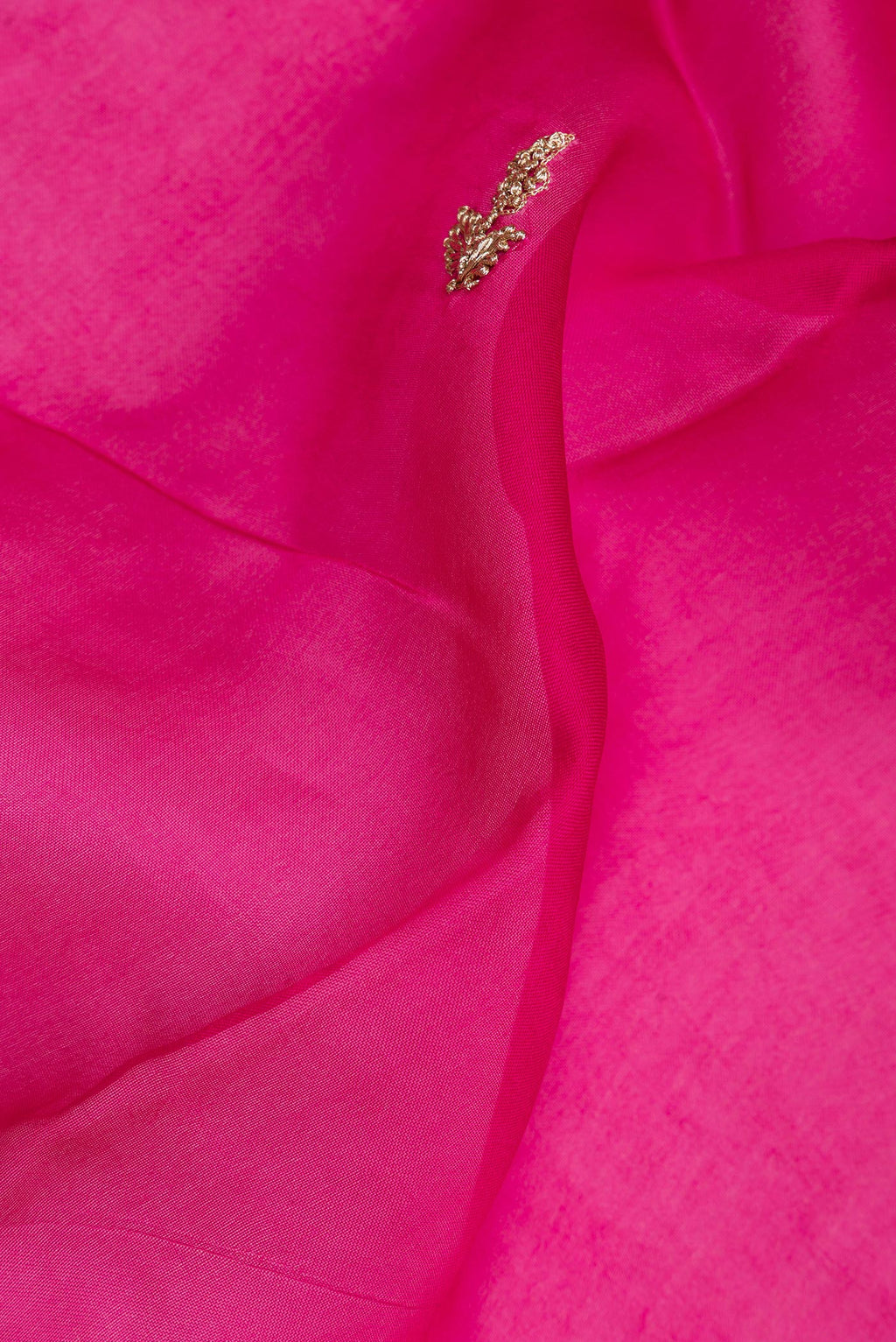 Close up of Dark Pink Dual Tone Organza Saree with Embroidery on the body and Embroidery Border.  displaying folds